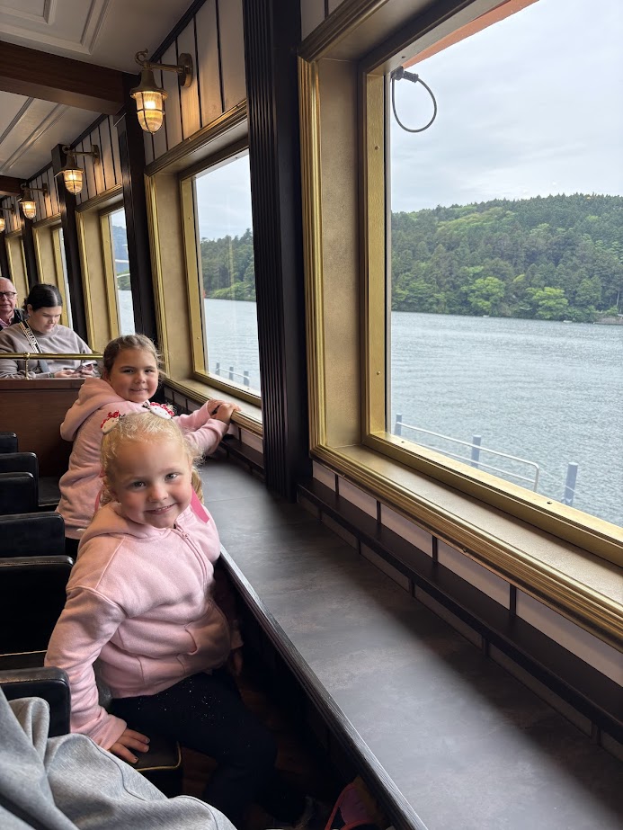 Kids by pirate ship windows